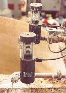 in this particular application photo, the plastic valves are the only thing not affected by the corrosive atmosphere and process.  These happen to be normally-closed (spring return) air operated shut-off valves; flow in the photo is from right to left.  The internal flowpath is a globe pattern; a volcano-type orifice with a plug.  The spring force keeps the plug down; air pressure (when actuated) forces the valve open...