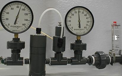 photo of Plast-O-Matic PRA Series regulator with optional Series PRS Stabilizer in a flowing condition